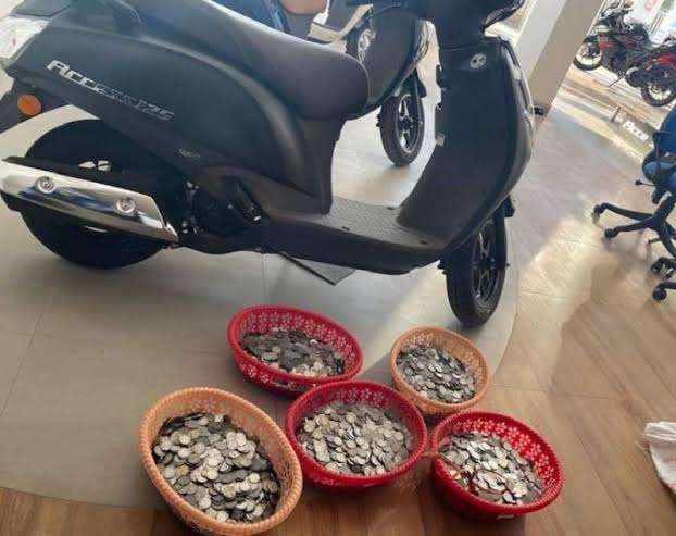 Assam man buys dream scooter with coins