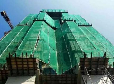 Interesting facts why under construction building is covered with green curtain